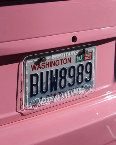 “Keep On Dreaming” Clear License Plate Frame